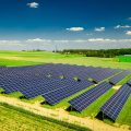 Amazing aerial view of solar panels on green field